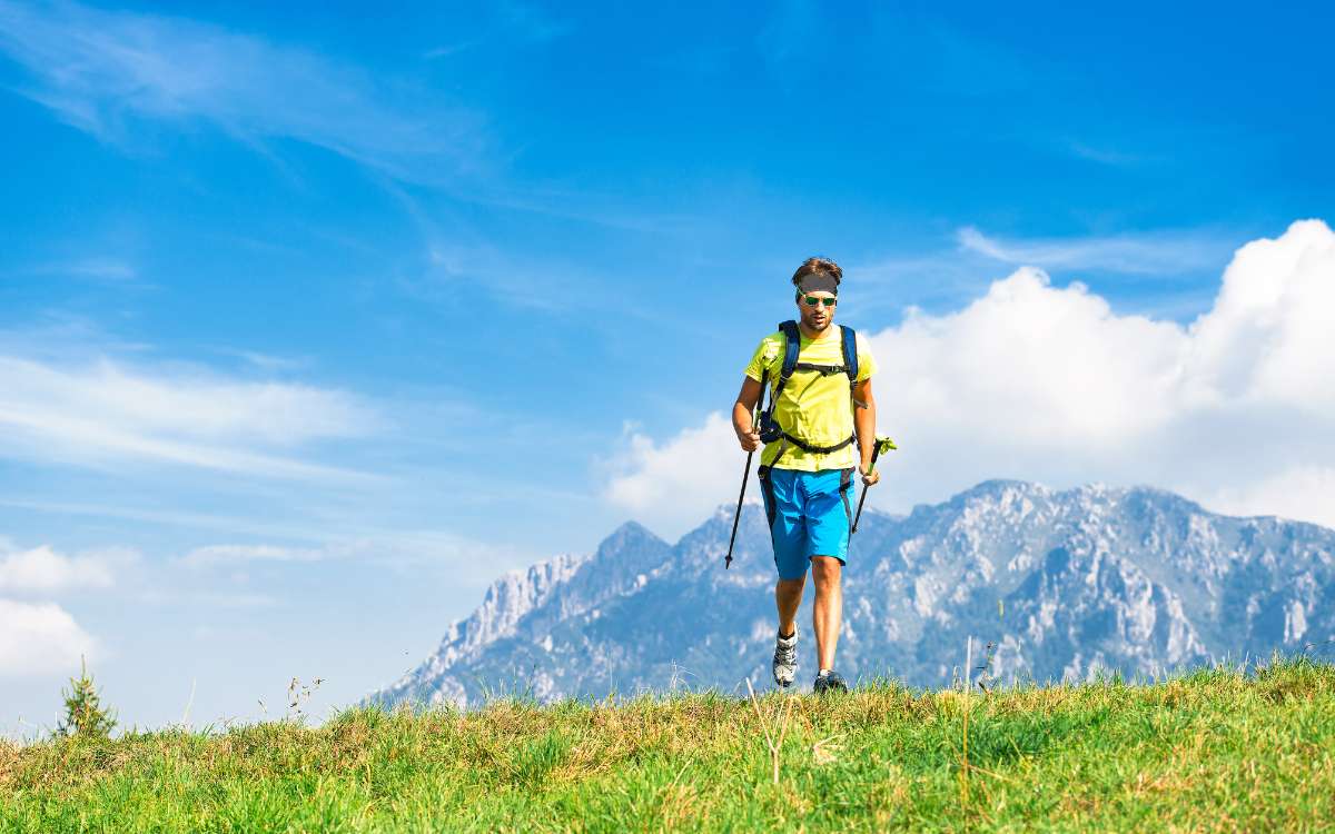 man hiking in front of mountain